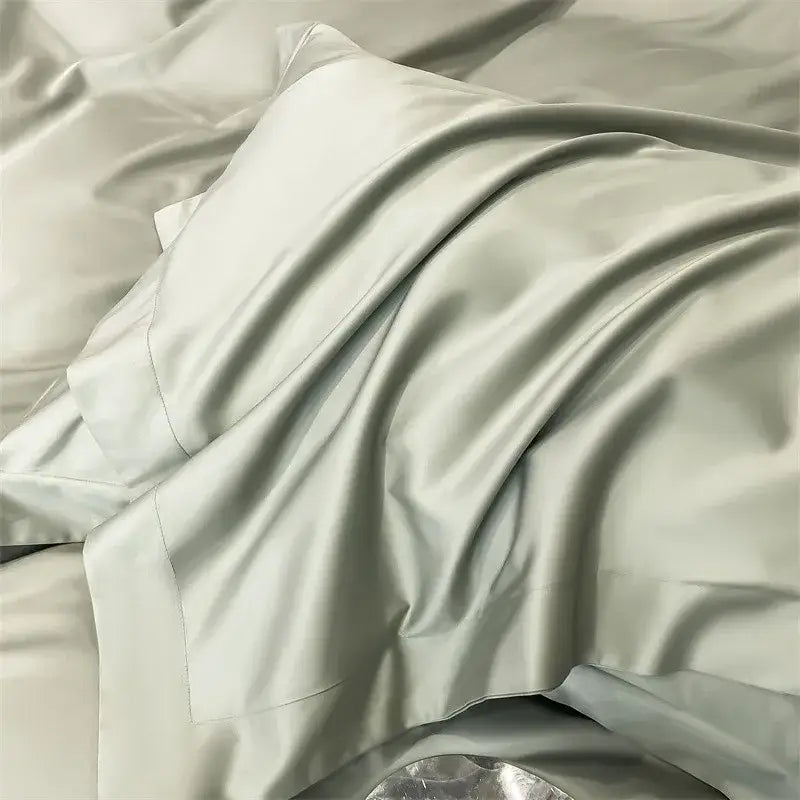A soft light gray satin pillowcase with a glossy finish from decorbites™ luxurious egyptian cotton bedding set 1000tc including duvet cover and fitted sheet