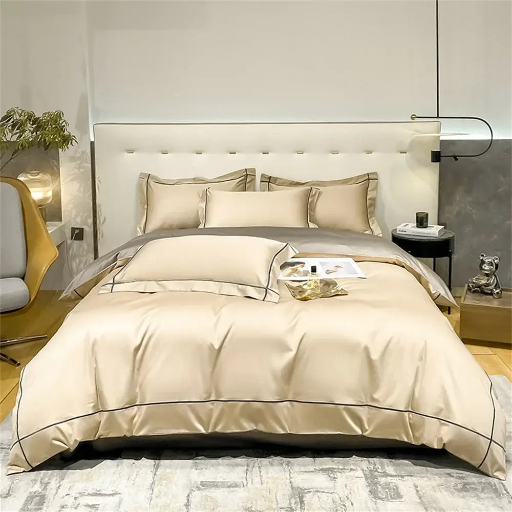 Beige satin egyptian cotton bedding set with black piping detail featuring an embroidered duvet cover by decorbites