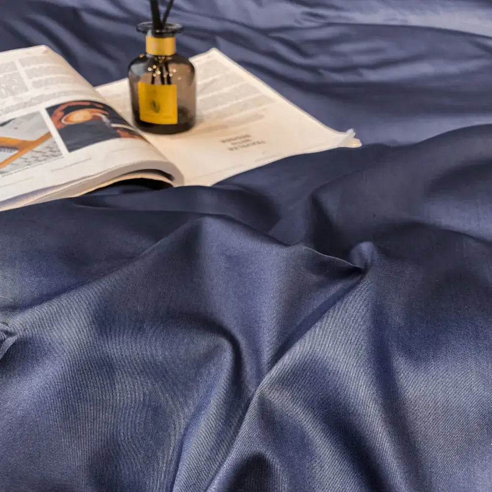 Deep navy satin duvet cover with subtle woven texture in DecorBites luxurious Egyptian cotton bedding set
