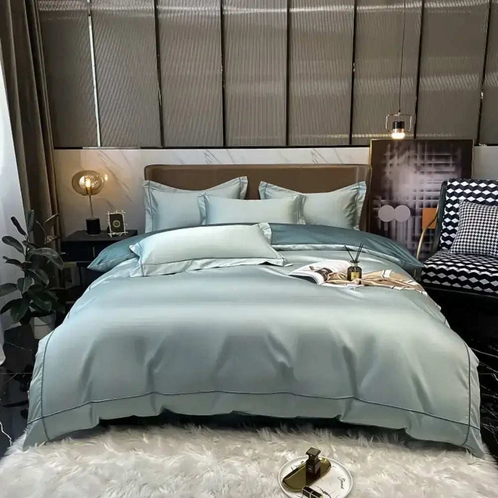 Light blue satin egyptian cotton bedding set with subtle stitched detailing and matching duvet cover by DecorBites™ Luxurious