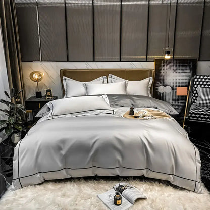 Luxury silver satin egyptian cotton duvet cover bedding set with elegant black piping and matching pillowcases in modern bedroom