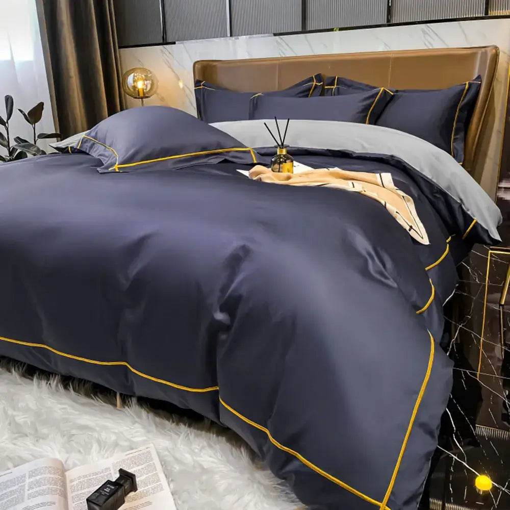 Navy blue satin duvet cover bedding set with gold piping accents made from luxurious egyptian cotton by DecorBites