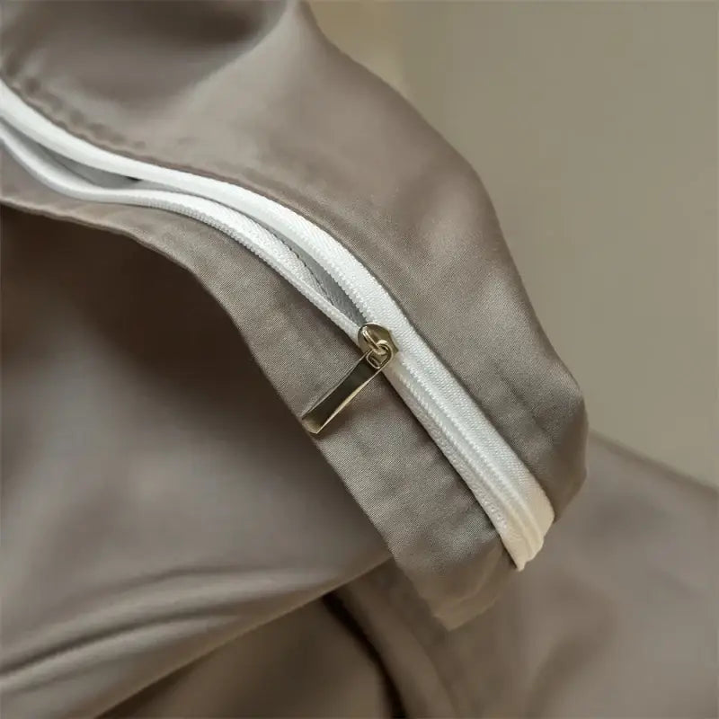 DecorBites Luxurious lyocell silk pillowcase in taupe satin with white zipper and gold pull for duvet cover or sheet sets
