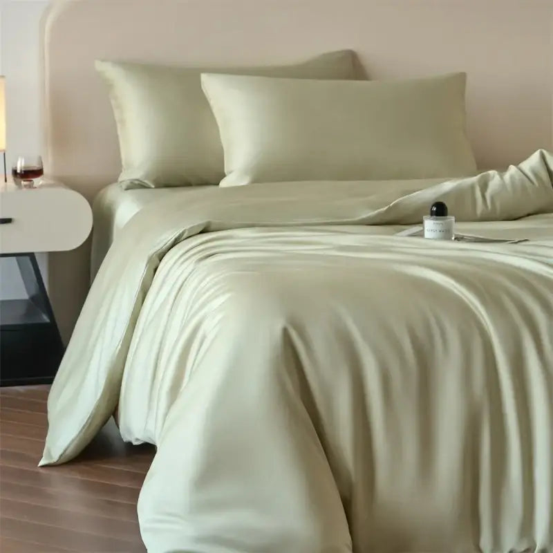 Decorbites luxurious lyocell silk duvet cover set in soft sage green satin with matching fitted sheet and pillowcases
