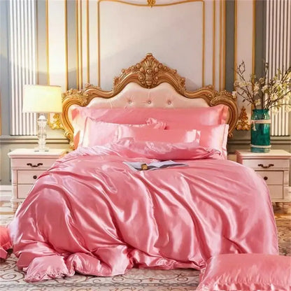 Pink mulberry silk bedding set with duvet cover quilt and pillows featuring ornate gold headboard by decorbites