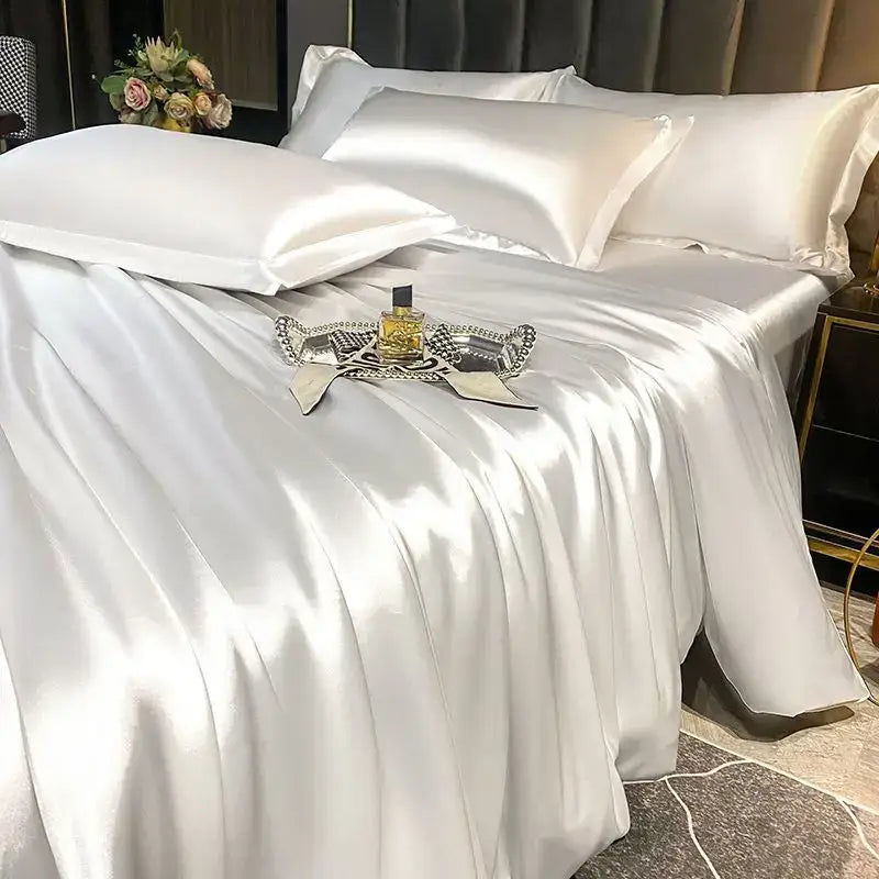 White satin duvet cover and bed sheet with glossy smooth texture and elegant sheen from DecorBites luxurious nordic silk bedding set