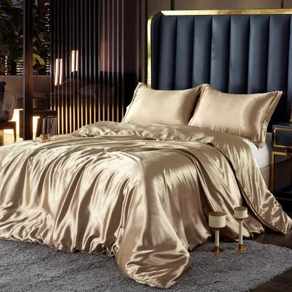 Glossy champagne-colored silk duvet cover and pcs duvet cover elegantly draped over a width bed by DecorBites™