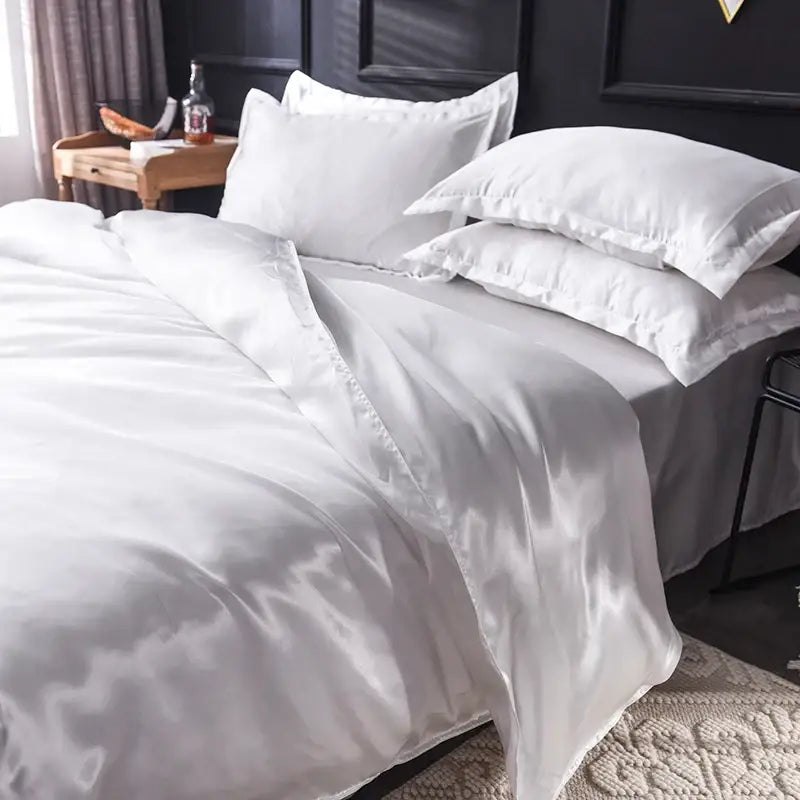 White satin duvet cover and pillowcases with a smooth glossy finish in the DecorBites™ silk bedding set