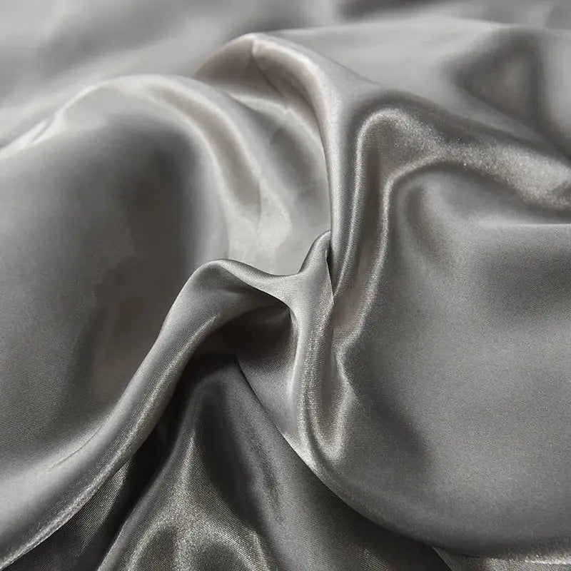 Decorbites™ luxurious silk bedding set in silver-gray satin with smooth glossy finish and flowing folds