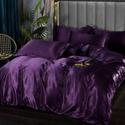 Lustrous deep purple satin DecorBites™ luxurious silk 3 pcs duvet cover set with matching pillows and tufted headboard