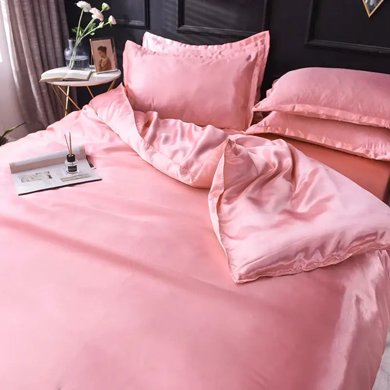 Pink satin silk bedding set by decorbites featuring smooth glossy finish bed sheet and matching duvet cover