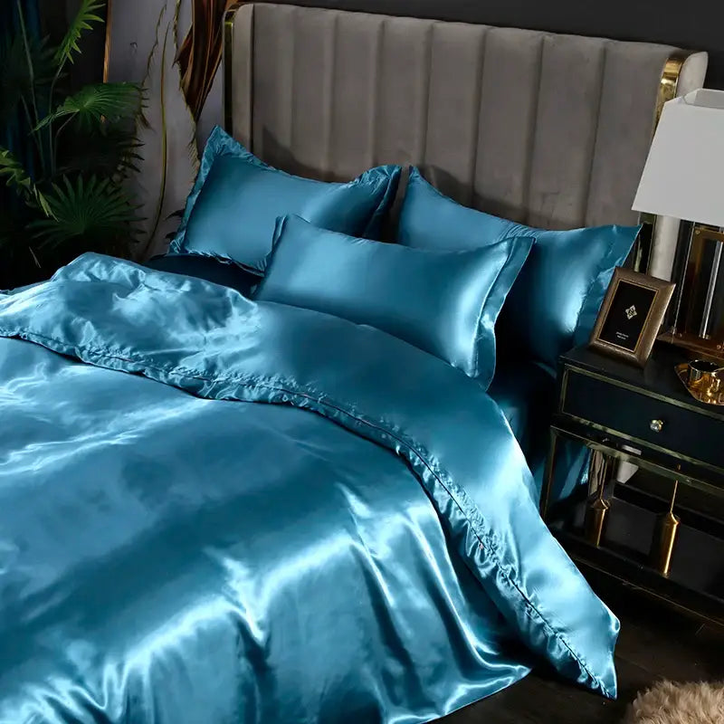 Teal satin duvet cover and bedding set with glossy finish and matching pillowcases from decorbites luxurious silk collection