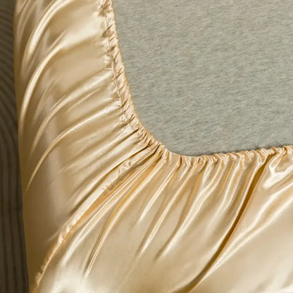 Decorbites™ luxurious solid color satin bedding set featuring a gold satin flat sheet with glossy finish and elasticized edge