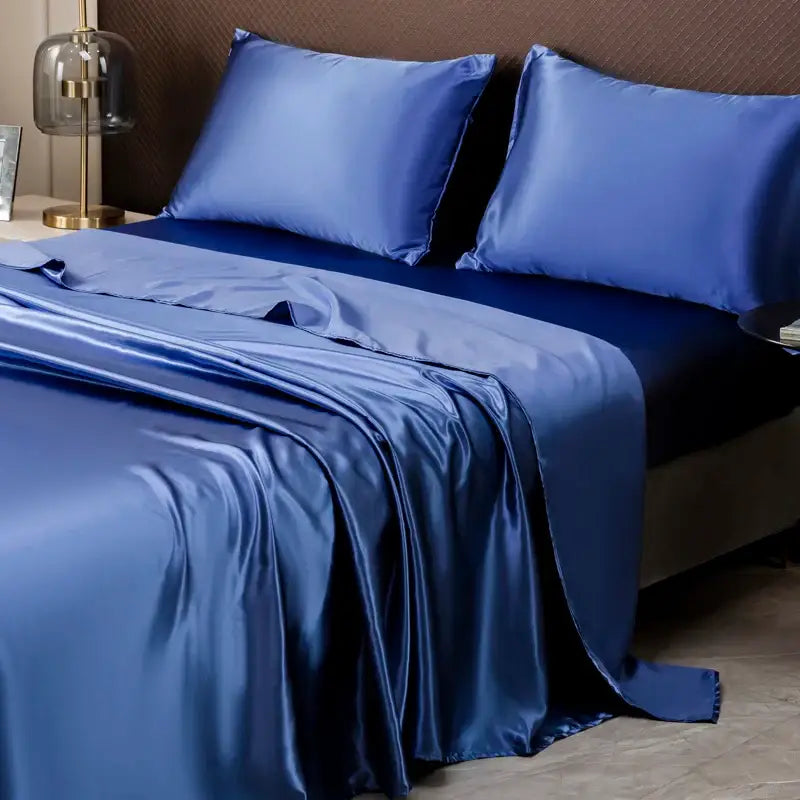 Royal blue satin bedding set with a smooth glossy finish featuring a solid color flat sheet by DecorBites™
