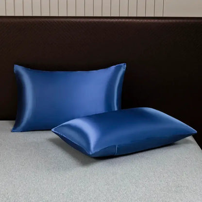 Two royal blue satin pillowcases with a smooth glossy finish from the DecorBites™ luxurious solid color bedding set