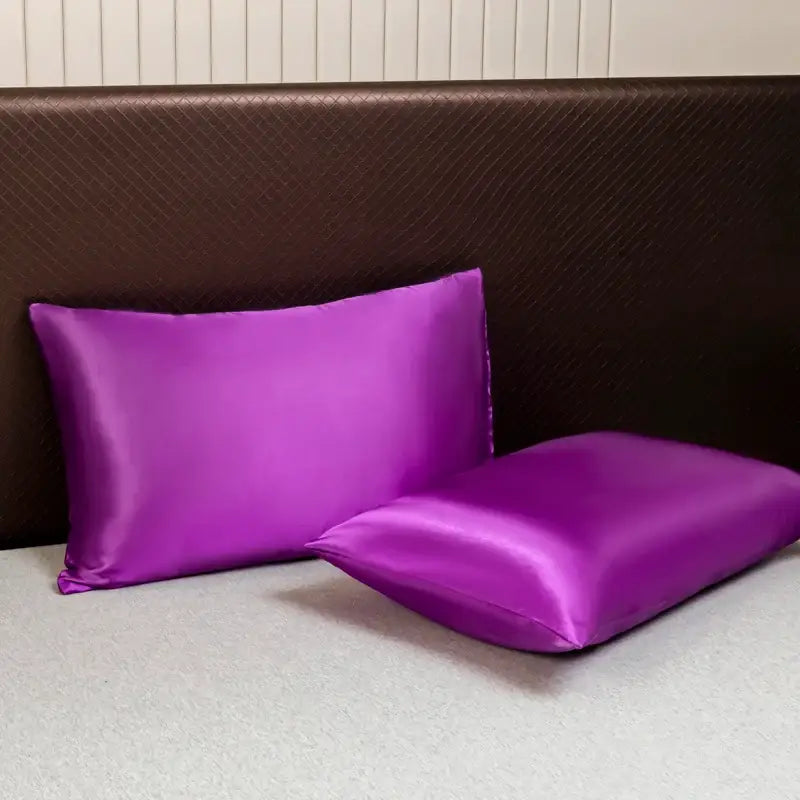 Vibrant purple satin pillowcases with a smooth glossy finish from decorbites luxurious solid color bedding set