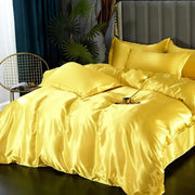 Golden satin DecorBites™ luxurious silk bedding set with plush duvet cover and matching pillows for width bed