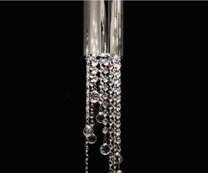A luxury chrome crystal led chandelier with cascading clear faceted beads for staircase illumination