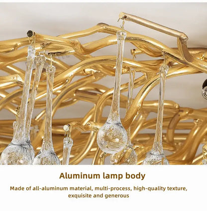 Golden aluminum luxury crystal chandelier with clear glass droplet pendants for elegant home decor by DecorBites™
