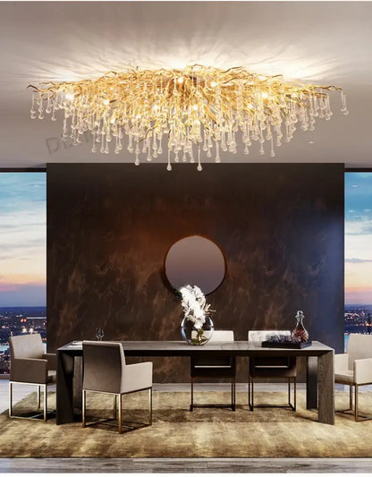 Golden branch-like luxury crystal chandelier with dangling crystal droplets from decorbites for home decor