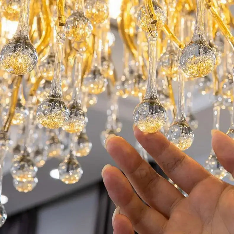 DecorBites luxury crystal chandelier with golden hand-blown glass and intricate droplet-shaped crystals for home decor