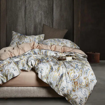 Luxurious cream-colored egyptian cotton duvet cover with gold and blue paisley patterns and satin inner lining by decorbites