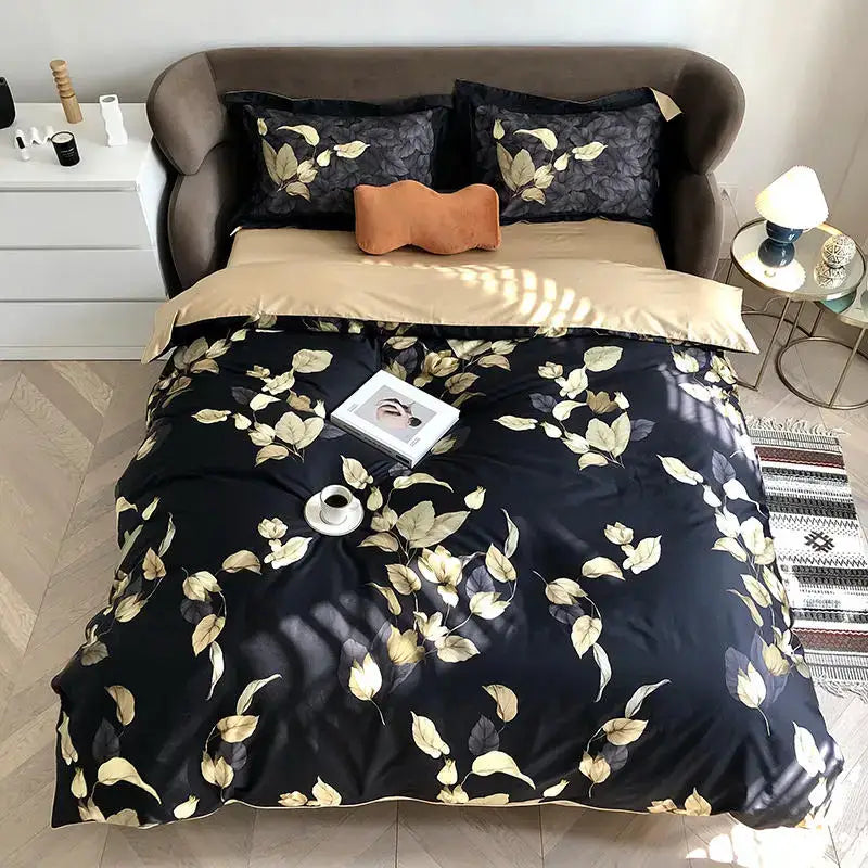 Black satin DecorBites luxury Egyptian cotton duvet cover with gold leaf pattern and matching pillowcases set with orange accent pillow