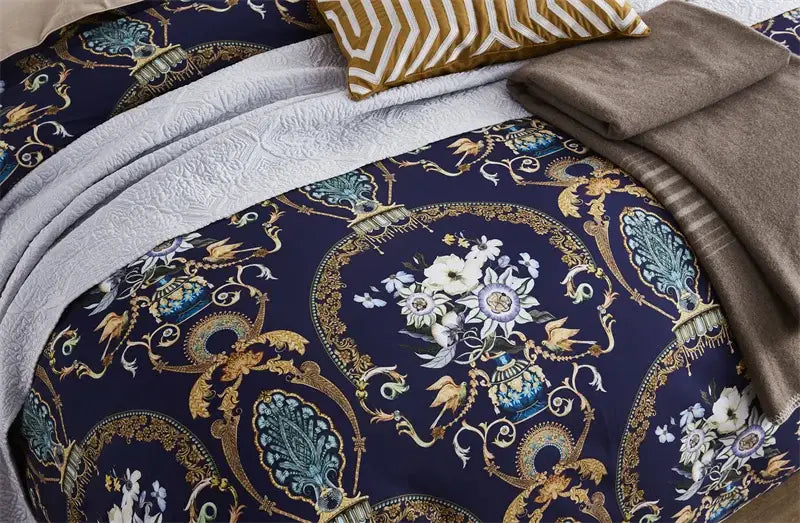 The navy blue duvet cover from DecorBites™ luxury egyptian cotton bedding set features gold and teal baroque floral motifs