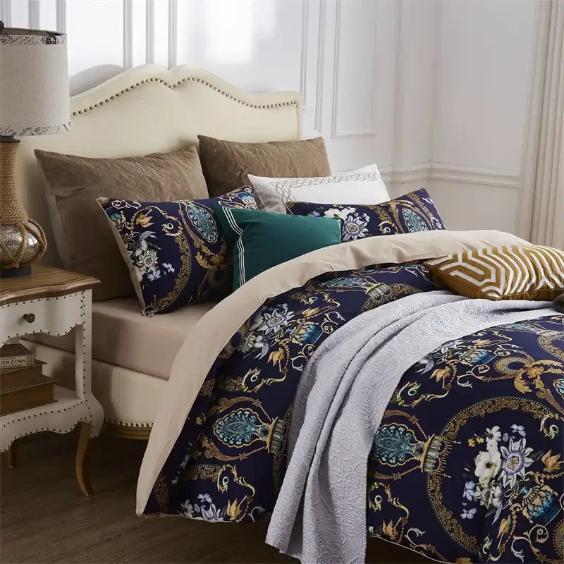 Luxurious navy blue duvet cover and coordinating pieces pillowcases with gold and teal baroque patterns in egyptian cotton