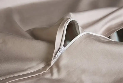 Beige satin duvet cover with subtle sheen and white zipper closure from decorbites luxury egyptian cotton bedding set