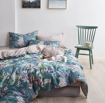 Teal and pink floral printed duvet cover and pillowcases set in egyptian cotton with a satin-like finish by decorbites