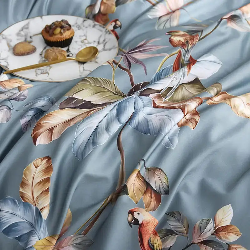 Light blue satin duvet cover with tropical parrot print in brown gold and muted green from DecorBites luxury cotton set