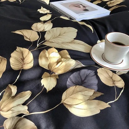 Black satin duvet cover with intricate gold and muted purple leaf patterns from decorbites luxury flamingo leaf bedding set in cotton