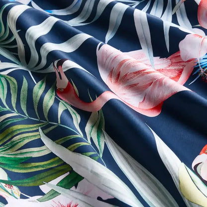 DecorBites™ luxury flamingo leaf duvet cover set with pink flamingos and green palm leaves on navy cotton fabric