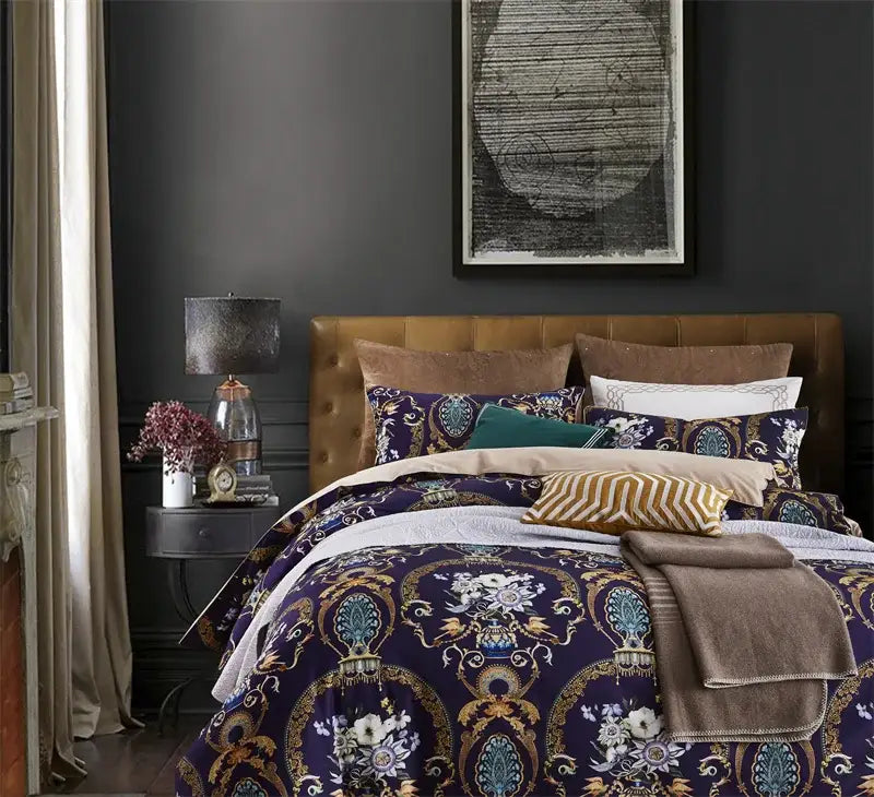 The DecorBites luxury flamingo leaf duvet cover set features navy blue cotton with gold and teal floral motifs and coordinating pillowcases