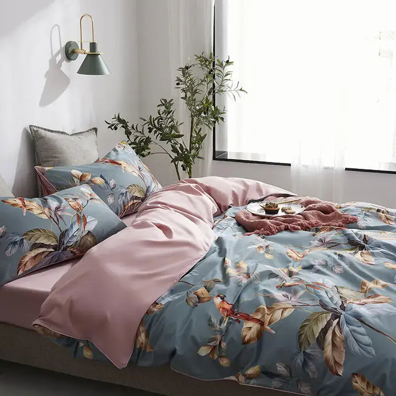 DecorBites™ luxury flamingo leaf cotton duvet cover set in blue with pink satin inner lining and matching pieces pillowcases
