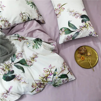 White duvet cover with pink and green orchid floral print and matching lavender satin pillowcases from decorbites™ luxury set