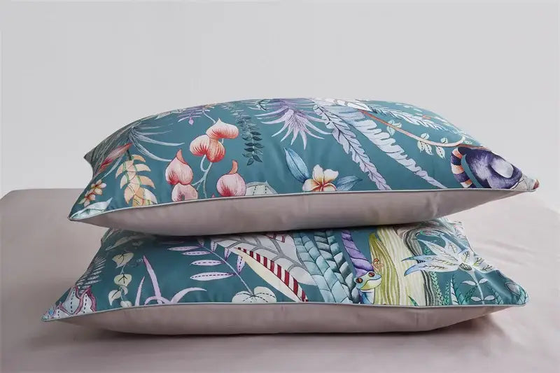 Teal floral-patterned pillow with soft fabric and subtle stitching details from DecorBites™ luxury flamingo leaf duvet cover set