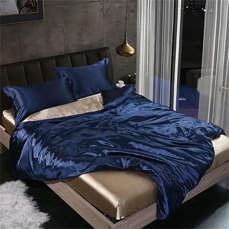 Deep blue satin duvet cover set with matching pillowcases and gold-trimmed lining in DecorBites™ mulberry silk bedding set