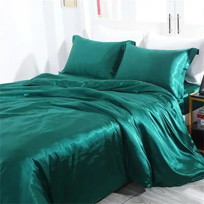 Emerald green mulberry silk bedding set by decorbites with a glossy satin finish including duvet cover and sheets