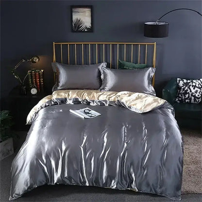 Decorbites™ luxury mulberry silk bedding set featuring a shiny silver satin duvet cover with gold inner lining and pillowcases