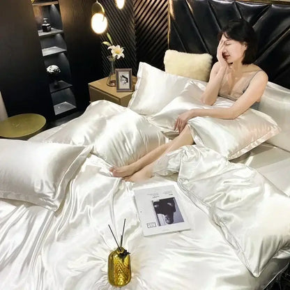 Shiny white satin mulberry silk bedding set with matching duvet cover and pillows from decorbites luxury collection