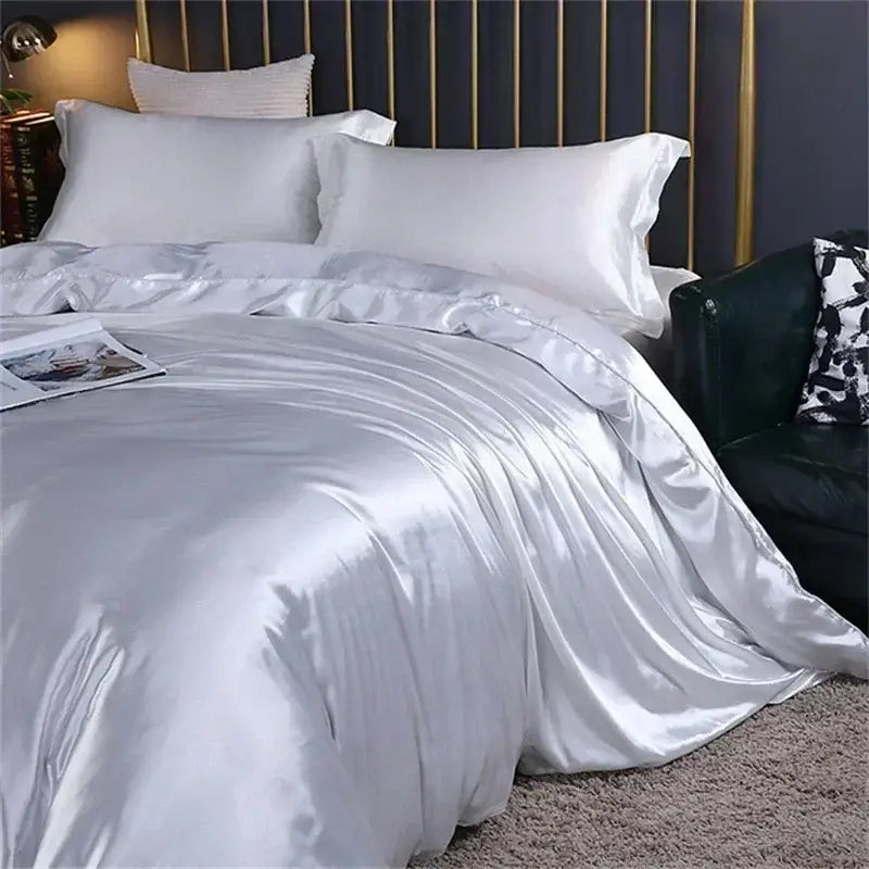 Silver satin duvet cover with smooth glossy finish and elegant folds in decorbites™ luxury mulberry silk bedding set