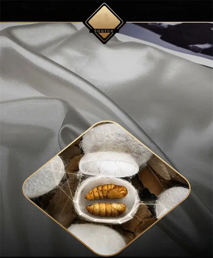 A white ceramic bowl with golden-brown silkworms among silk cocoons illustrating DecorBites luxury mulberry silk bedding set