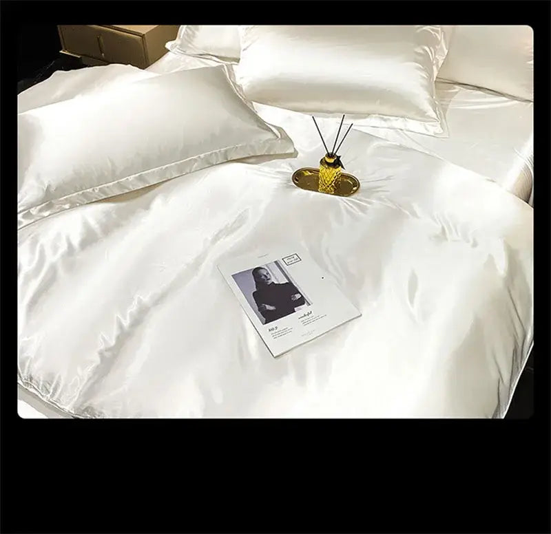 Decorbites™ luxury mulberry silk bedding set in white satin with glossy finish and matching pillows for elegant comfort