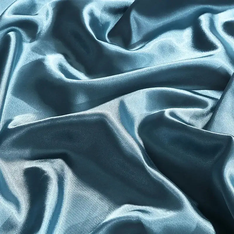 Teal satin duvet cover from decorbites luxury silk bedding set with smooth glossy finish and flowing folds
