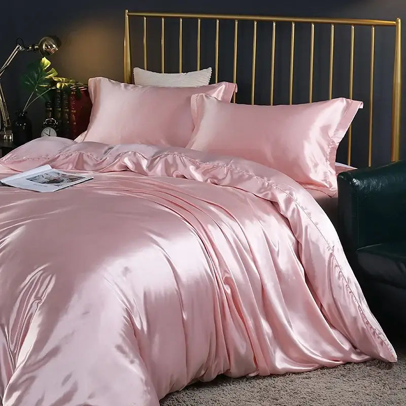 Pink satin duvet cover and bed sheet set with a glossy finish and matching pillowcases from decorbites luxury silk bedding set