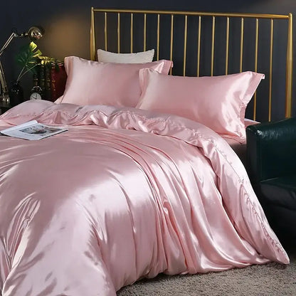 Pink satin duvet cover and bed sheet set with a glossy finish and matching pillowcases from decorbites luxury silk bedding set