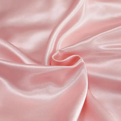 Soft blush pink satin pcduvet cover with a smooth glossy finish and gentle folds for width bed solid color bedding set
