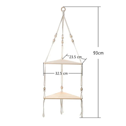 Beige DecorBites™ macrame wall hanging corner shelf with two triangular wooden tiers and decorative beads for boho decor